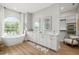 Spacious bathroom features dual vanities, a freestanding tub, and a well-organized walk-in closet at 30247 Fairway Dr, Wesley Chapel, FL 33543