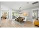 Bright dining room with a modern light fixture and views of the outdoor patio area at 30247 Fairway Dr, Wesley Chapel, FL 33543