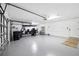 Spacious three-car garage with ample storage space and golf cart parking at 30247 Fairway Dr, Wesley Chapel, FL 33543