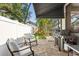 Outdoor patio area featuring a grill, seating, and manicured landscaping perfect for outdoor entertaining at 3325 W Wallcraft Ave, Tampa, FL 33611