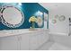 Elegant bathroom features a double vanity, stylish mirrors, and a soaking tub for a spa-like experience at 3325 W Wallcraft Ave, Tampa, FL 33611