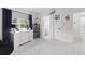 Bright bedroom with a dresser, space-themed decorations and a view into an ensuite bathroom at 3325 W Wallcraft Ave, Tampa, FL 33611