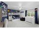 Fun ' bedroom with bunk beds, playful wall decor, and a comfortable seating area near the window at 3325 W Wallcraft Ave, Tampa, FL 33611