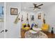 Eclectic bonus room featuring musical instruments, decor, and a ceiling fan, offering a unique and inviting space at 3325 W Wallcraft Ave, Tampa, FL 33611
