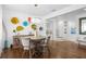 Stylish dining area with modern lighting, hardwood floors, and elegant decor for comfortable and sophisticated dining at 3325 W Wallcraft Ave, Tampa, FL 33611