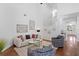 Bright living room with stairs, modern artwork, and comfortable seating creates a spacious and inviting atmosphere at 3325 W Wallcraft Ave, Tampa, FL 33611
