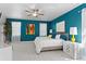 Bright main bedroom featuring a ceiling fan, stylish decor, and ample natural light at 3325 W Wallcraft Ave, Tampa, FL 33611
