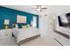 Stylish main bedroom features modern decor, a ceiling fan, and bright lighting for a relaxing atmosphere at 3325 W Wallcraft Ave, Tampa, FL 33611