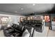 Luxurious media room with tiered seating, a wet bar, and sports memorabilia displayed on the wall at 3325 W Wallcraft Ave, Tampa, FL 33611