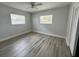 Neutral bedroom with plenty of natural light and gray floors at 3599 66Th N Way, St Petersburg, FL 33710