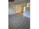 Large living room with open layout and neutral tile floors at 3599 66Th N Way, St Petersburg, FL 33710