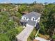 Stunning aerial view of a two-story home surrounded by lush greenery at 4251 W Roland St, Tampa, FL 33609