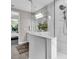 Modern bathroom with a glass-enclosed shower, dual vanity, and sleek finishes throughout at 4251 W Roland St, Tampa, FL 33609