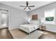 Bright bedroom with hardwood floors, ceiling fan, and a window providing natural light at 4251 W Roland St, Tampa, FL 33609