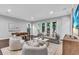 Spacious living area with hardwood floors, comfortable seating, and ample natural light at 4251 W Roland St, Tampa, FL 33609