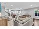 Expansive living space featuring hardwood floors, living and dining area and open kitchen at 4251 W Roland St, Tampa, FL 33609
