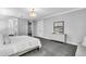Comfortable main bedroom with carpet, neutral tones, and ensuite bathroom access and dresser at 4251 W Roland St, Tampa, FL 33609
