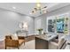 Inviting home office space with modern light fixture and view of the exterior at 4251 W Roland St, Tampa, FL 33609