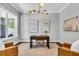 Bright home office featuring modern decor, hardwood floors, and large windows at 4251 W Roland St, Tampa, FL 33609