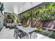 Enclosed patio with lush tropical views from every angle and outdoor seating at 4251 W Roland St, Tampa, FL 33609