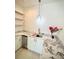 Stylish bar area with marble countertop, mini fridge, custom shelving, and chic pendant light at 4321 S Renellie Dr, Tampa, FL 33611