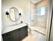 Modern bathroom featuring an oval mirror, large shower, and stylish vanity at 4321 S Renellie Dr, Tampa, FL 33611