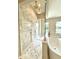 Luxurious bathroom with marble shower and soaking tub with gold fixtures at 4321 S Renellie Dr, Tampa, FL 33611