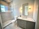 Updated bathroom featuring sleek fixtures, a glass shower, and modern lighting at 4321 S Renellie Dr, Tampa, FL 33611