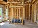 Framing view of interior under construction, showcasing exposed wooden beams and preparation for finishing touches at 4321 S Renellie Dr, Tampa, FL 33611