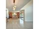 Spacious kitchen with a large center island, custom wood cabinets, marble counters, and modern lighting, ready for entertaining at 4321 S Renellie Dr, Tampa, FL 33611