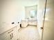 Charming laundry room with star-patterned tile and plenty of cabinet space at 4321 S Renellie Dr, Tampa, FL 33611