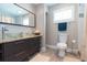 Bathroom featuring a glass vessel sink, granite countertops and gray tile flooring at 4516 S Trask St, Tampa, FL 33611