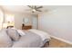 Cozy bedroom with wood floors, a ceiling fan, and natural light at 4516 S Trask St, Tampa, FL 33611
