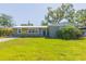 Well-maintained single-story home with lush green lawn and a beautifully landscaped front yard at 4516 S Trask St, Tampa, FL 33611
