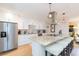 Modern kitchen features stainless steel appliances, granite countertops, and a center island with seating at 4516 S Trask St, Tampa, FL 33611