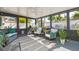 Relaxing sunroom with wicker furniture, plants, and lots of light at 4516 S Trask St, Tampa, FL 33611