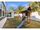 Backyard featuring a playset with a green slide, swing, and a chalkboard at 4545 1St N Ave, St Petersburg, FL 33713