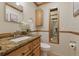 Updated bathroom featuring a granite countertop, neutral paint, a sink, toilet and a view of the shower at 4926 Camellia S Way, St Petersburg, FL 33705
