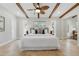 Bright bedroom featuring a large bed, wooden beams on the ceiling, and many windows for natural light at 4926 Camellia S Way, St Petersburg, FL 33705