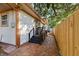 Exterior of home featuring a brick walkway, staircase, and wooden fence at 4926 Camellia S Way, St Petersburg, FL 33705