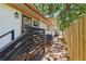 Exterior of home featuring a brick walkway, staircase, and a wooden fence at 4926 Camellia S Way, St Petersburg, FL 33705