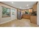 Well-equipped kitchen with stainless steel appliances, tile floors, and plenty of natural light at 4926 Camellia S Way, St Petersburg, FL 33705
