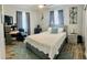 Comfortable bedroom with a gray bed, area rug, and curtains offering a quiet retreat at 5151 22Nd N Ave, St Petersburg, FL 33710