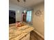 Bright kitchen featuring a center island with marble countertops, and stainless steel appliances at 5151 22Nd N Ave, St Petersburg, FL 33710