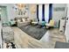 This stylish living room offers comfortable seating, a soft rug, attractive flooring and plenty of natural light at 5151 22Nd N Ave, St Petersburg, FL 33710