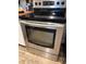 Close-up shot of stainless steel Samsung oven, set in a kitchen featuring wood style flooring at 5151 22Nd N Ave, St Petersburg, FL 33710