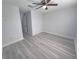 Bedroom with ceiling fan and vinyl plank flooring at 5509 Cumberland Star Ct, Lutz, FL 33558