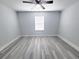 Bedroom featuring a window and ceiling fan at 5509 Cumberland Star Ct, Lutz, FL 33558