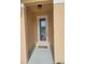 The front entry features a glass door, welcome mat, and overhead light at 5509 Cumberland Star Ct, Lutz, FL 33558