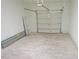 Spacious garage with a partially open door and plenty of room for parking and storage at 5509 Cumberland Star Ct, Lutz, FL 33558